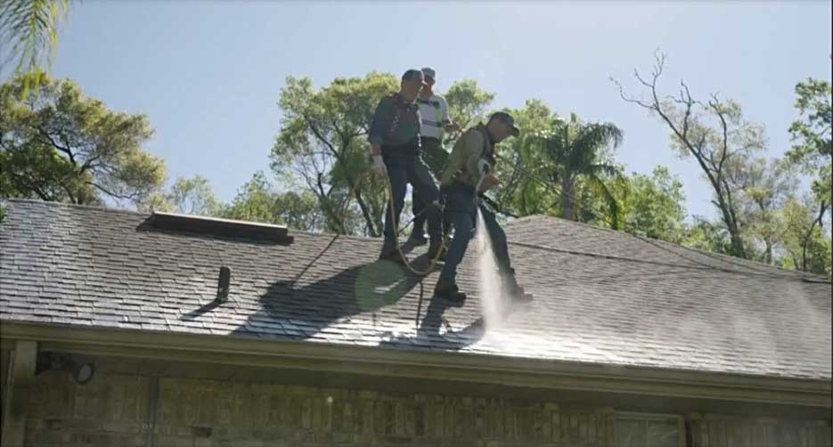 Mike Row applying Roof Maxx to a roof